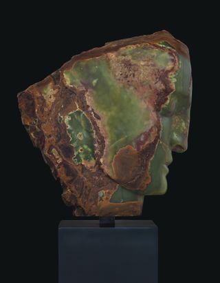 Green stone head sculpture