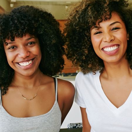 Smile, Jheri curl, Hairstyle, Jewellery, Facial expression, Style, Black hair, Ringlet, Afro, Necklace, 