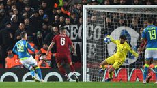 Liverpool’s Brazilian goalkeeper Alisson saves the shot from Napoli striker Arkadiusz Milik