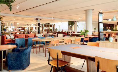 Inside Soho Works White City features a range of wooden and plush seating