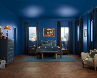 dark blue color-drenched bedroom