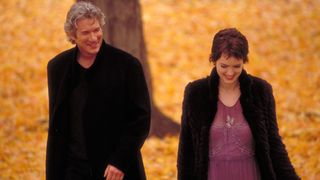 Richard Gere smiles at Winona Ryder as they walk through the leaves in 'Autumn in New York'