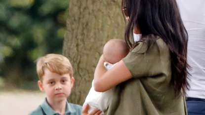 Prince George of Cambridge, Meghan, Duchess of Sussex and Archie Harrison Mountbatten-Windsor 