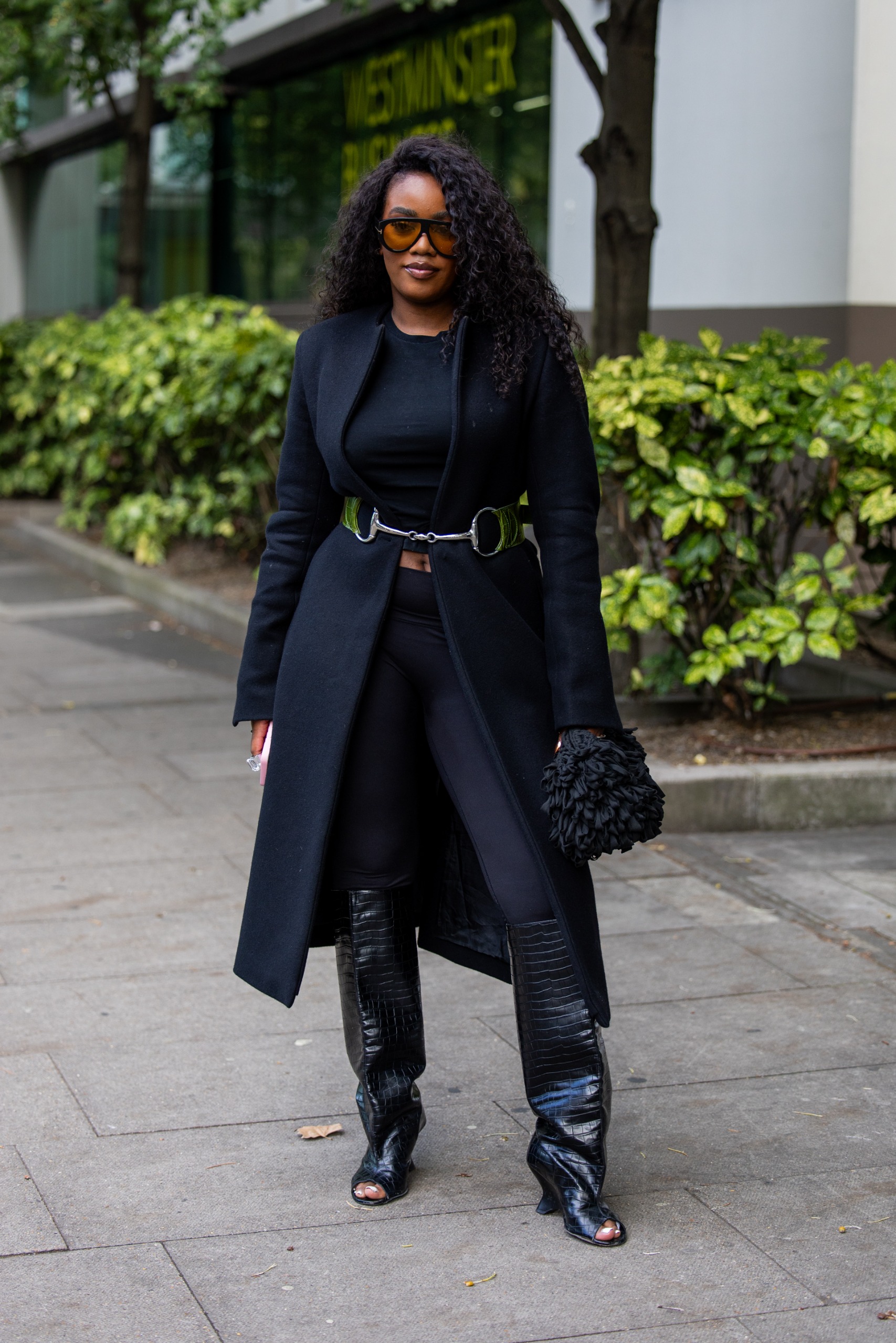 A guest wore the peep-toe boots trend at London Fashion Week 2026