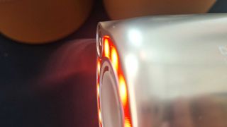 Dreame Miracle Pro hair dryer emitting a mist of essence