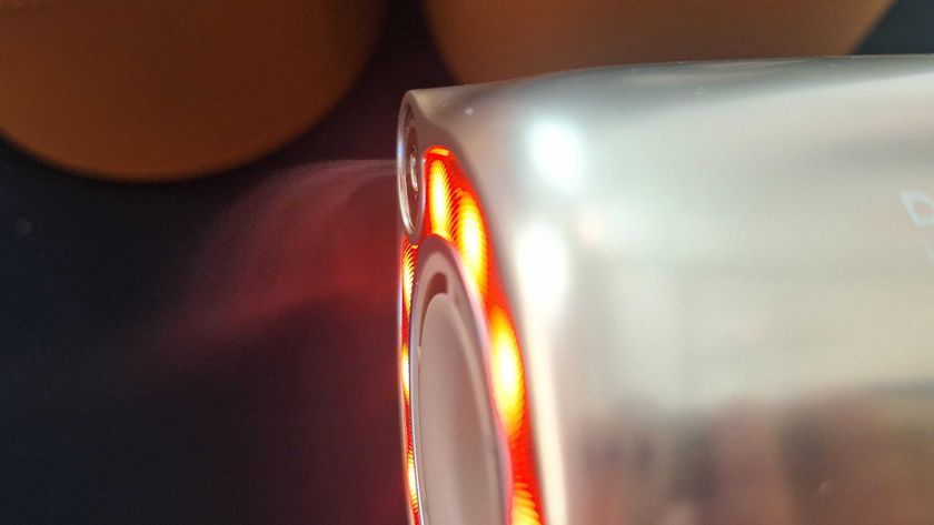 Dreame Miracle Pro hair dryer emitting a mist of essence