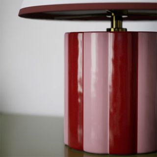 Close up of base on red M&S Lola lamp