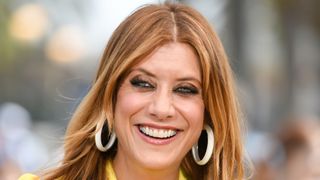 Kate Walsh pictured with copper hair and money-piece highlights whilst visiting "Extra" at Universal Studios Hollywood on July 19, 2019 in Universal City, California