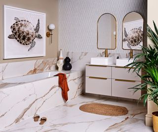 A neutral bathroom decorated with warm marble tiles