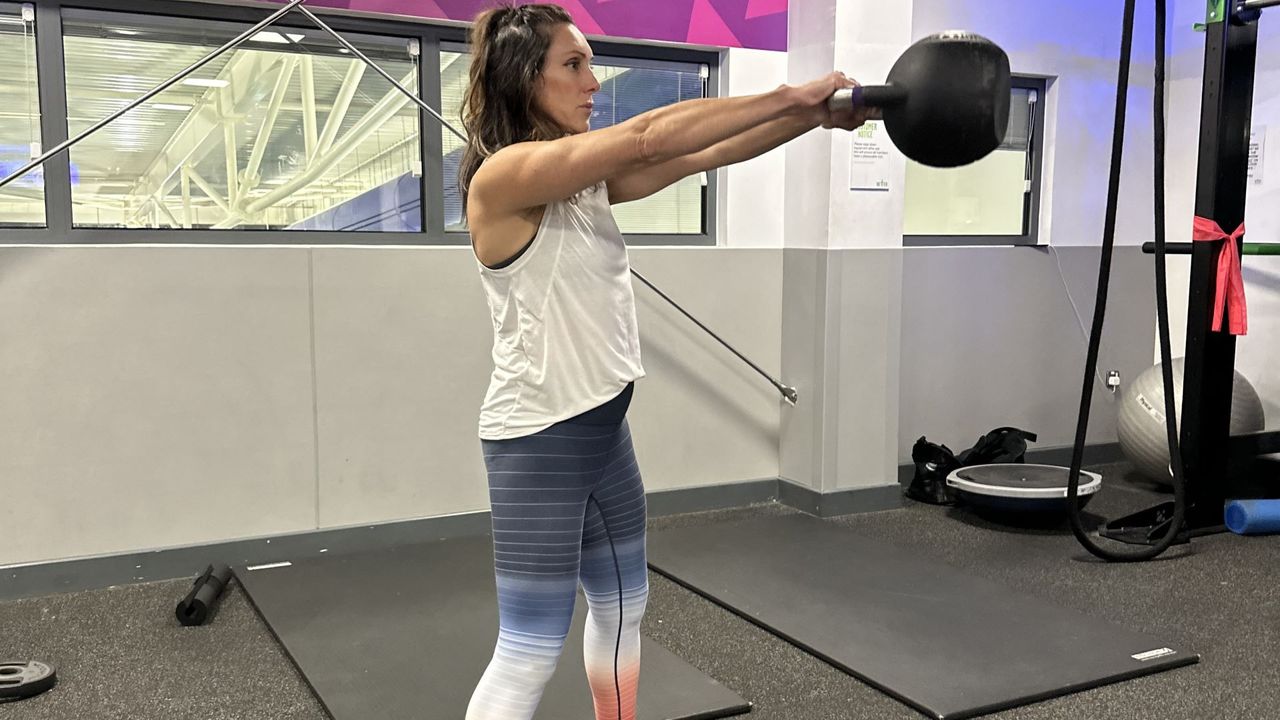 Personal trainer Jo Burland demonstrates a kettlebell swing