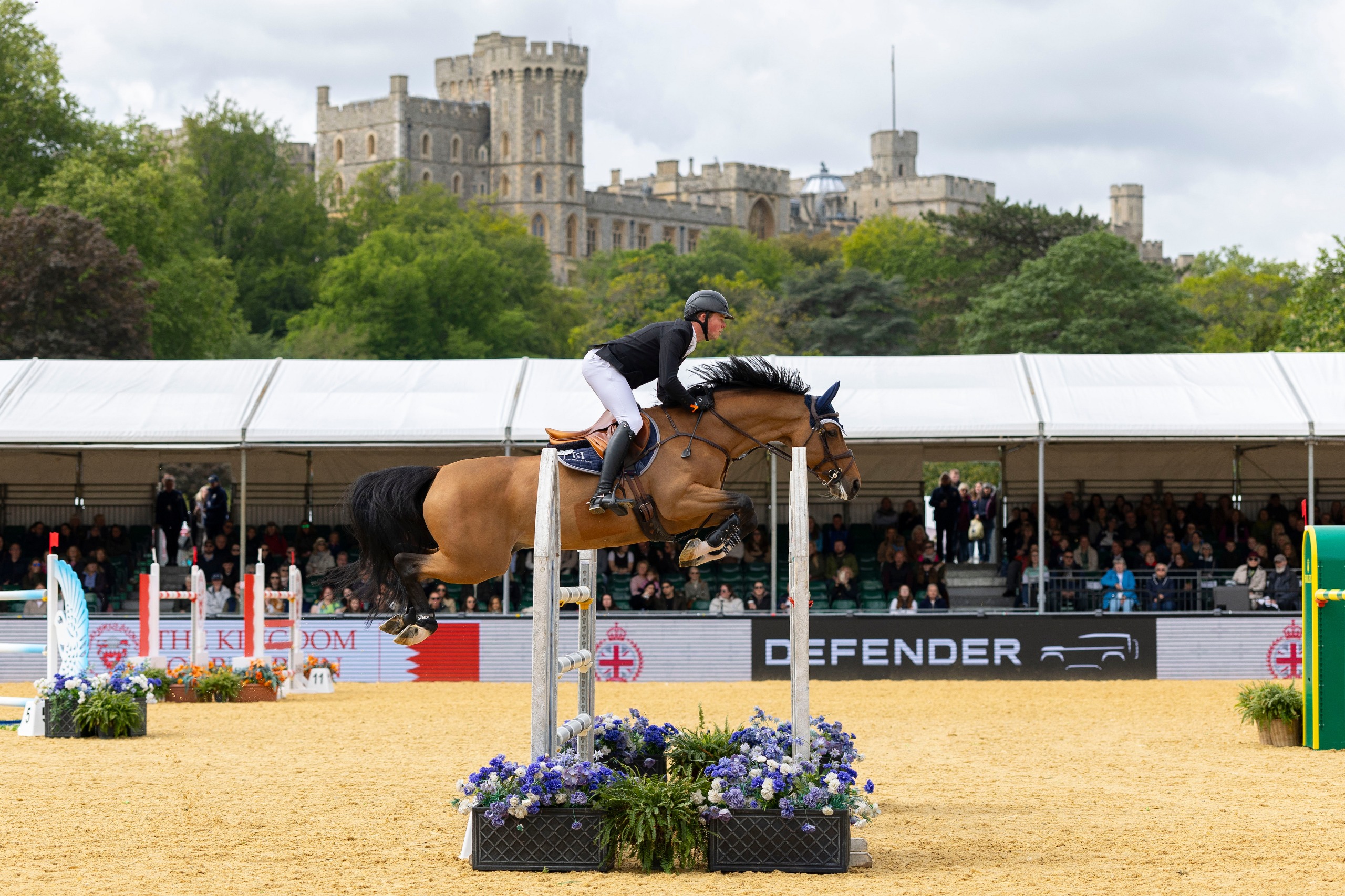 Harry Charles clears a jump in front of Windsor Castle
