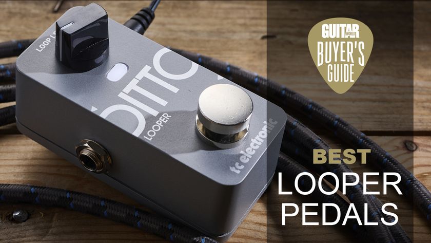 A TC Electronic Ditto 2 looper pedal lying on a wooden floor with a guitar cable