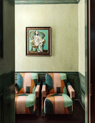 Mint green makes a great canvas for tan colored chairs
