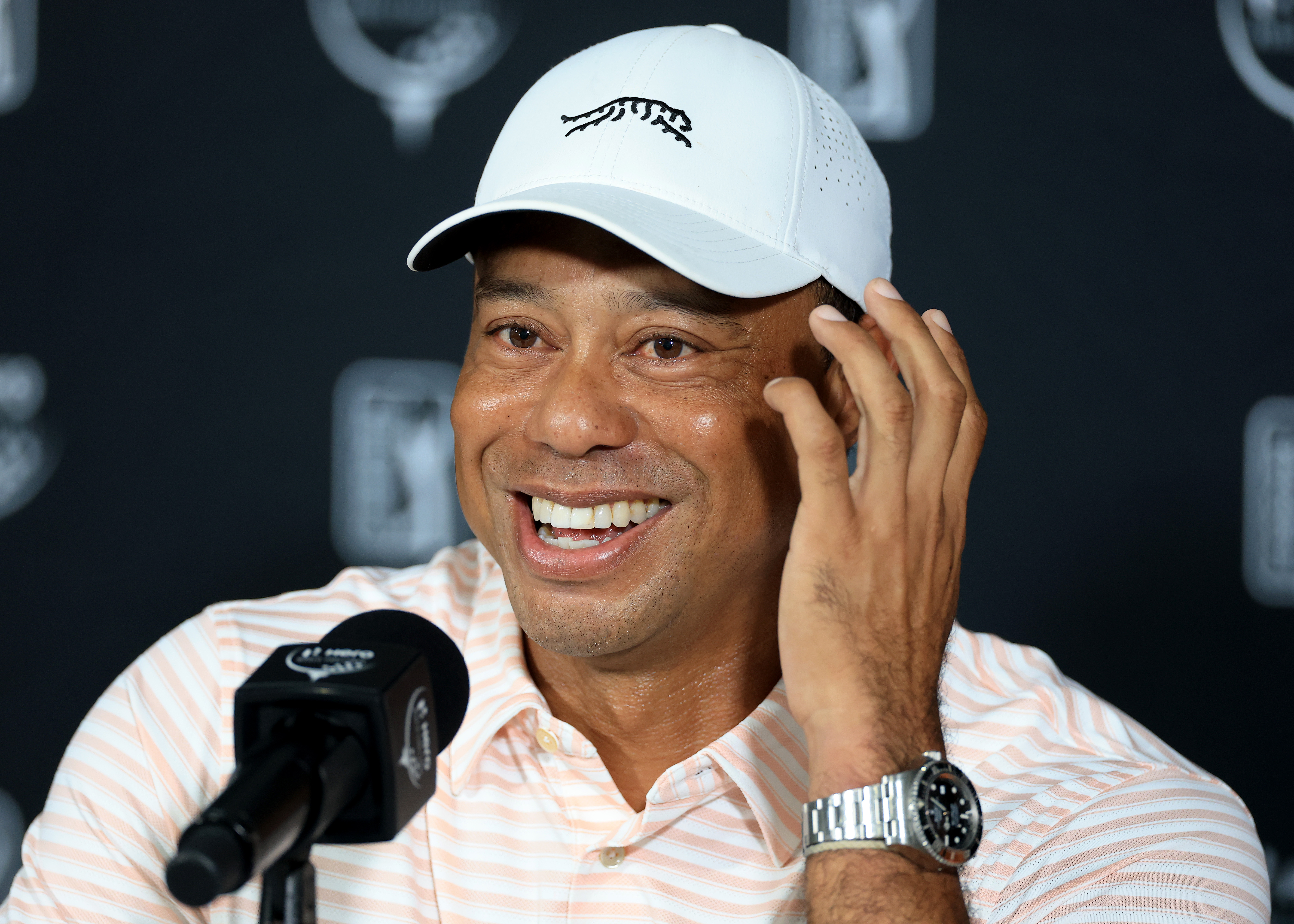 Tiger Woods speaks and smiles during his pre-tournament press conference ahead of the 2025 Hero World Challenge