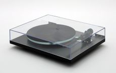 A photo of the Rega Planar 3 Eco Special turntable on a white background