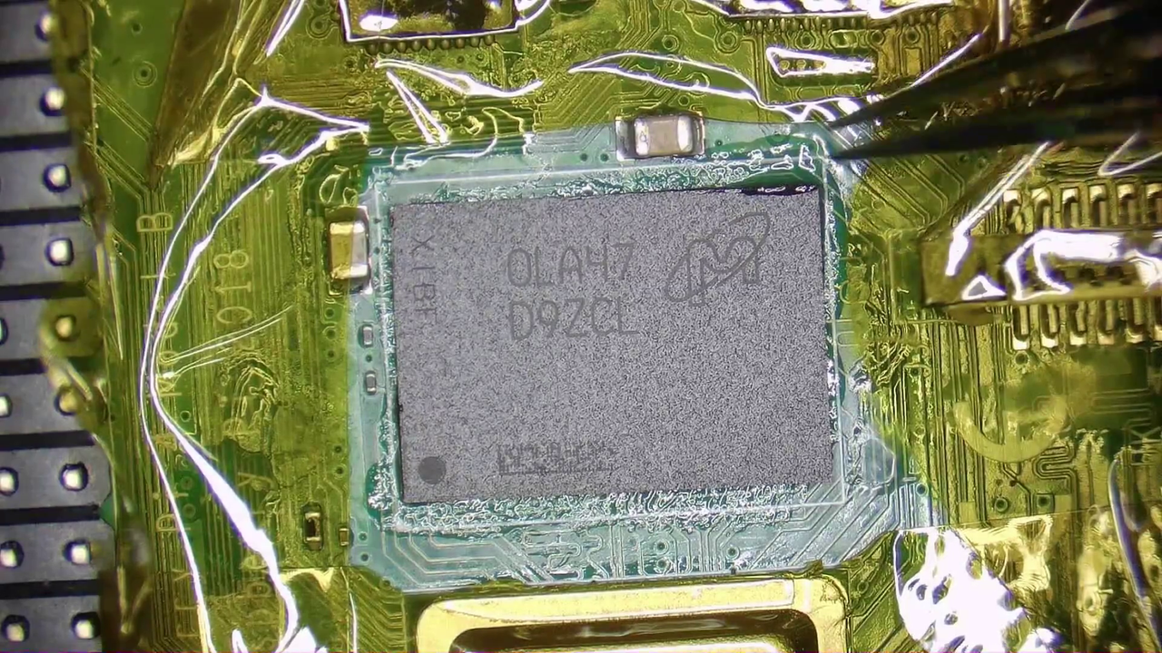 Replacing the 1GB RAM chip on a Raspberry Pi 4 with an 8GB RAM chip.