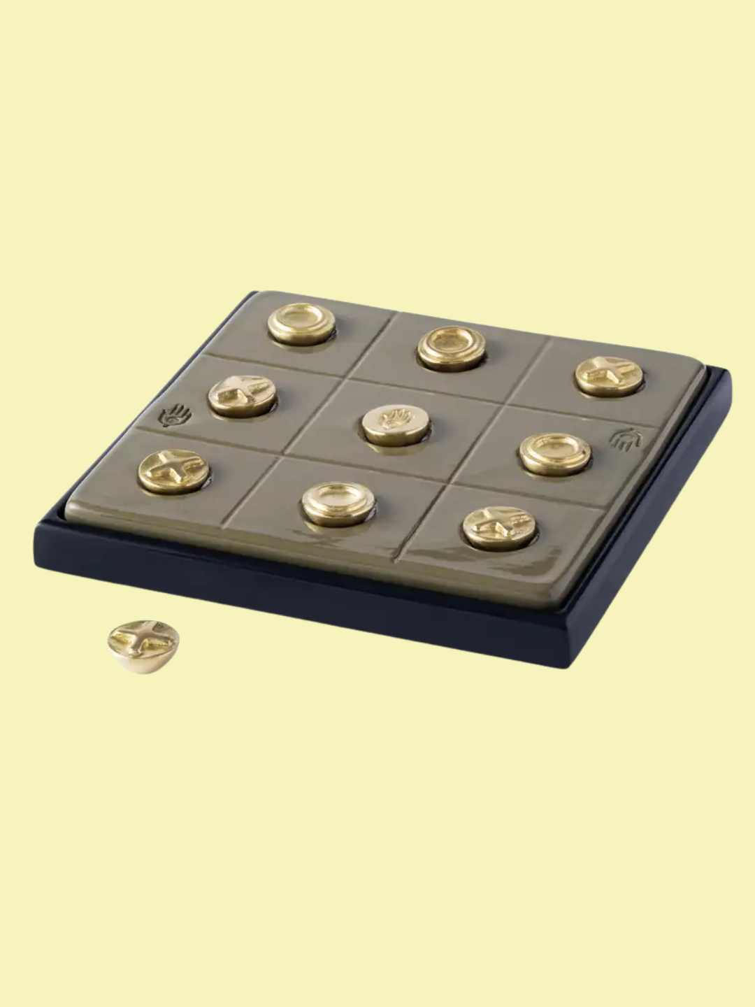 A ceramic and brass XO game