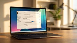 Laptop running Windows 11 in a modern office during golden hour.