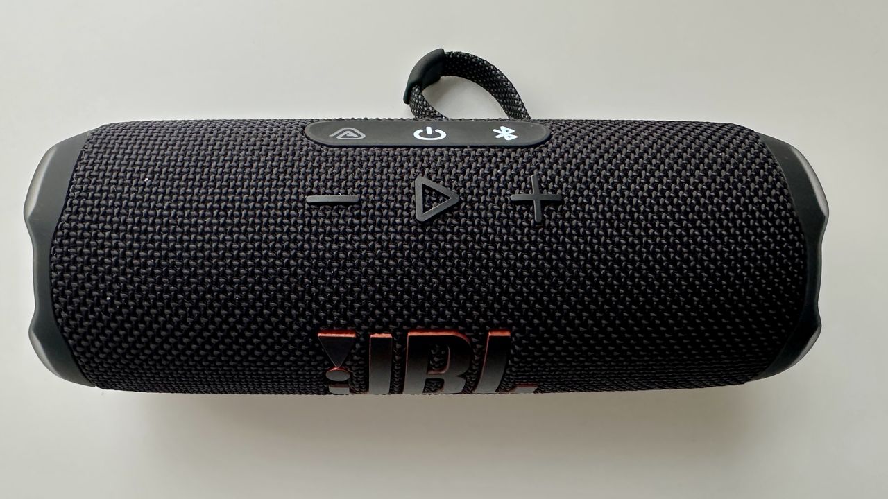 JBL Flip 7 portable Bluetooth speaker on a white surface