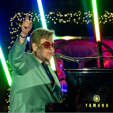 Elton John performs at Saks Fifth Avenue window unveiling and light show