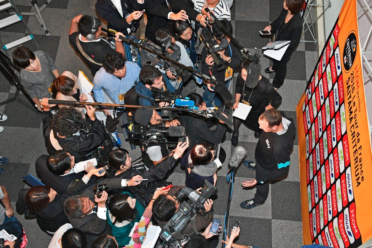 The media surround Chris Froome