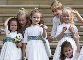 Princess Charlotte of Cambridge, Savannah Phillips, Maud Windsor, page boy Prince George of Cambridge, bridesmaids Isla Phillips, Theodora Williams and Mia Tindall wave as they leave after the royal wedding of Princess Eugenie of York to Jack Brooksbank
