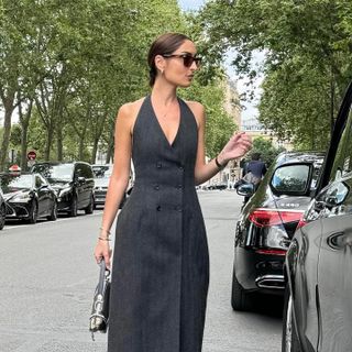 French woman wearing a gray dress