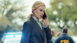 Nicole Kidman takes a call in front of FBI agents
