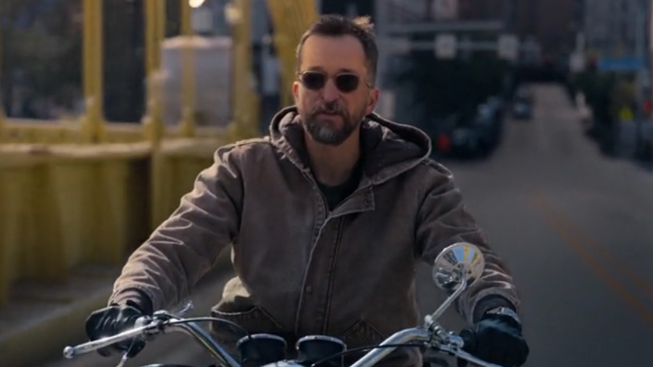 Noah Wyle as Robby riding a motorcycle and not wearing a helmet. 