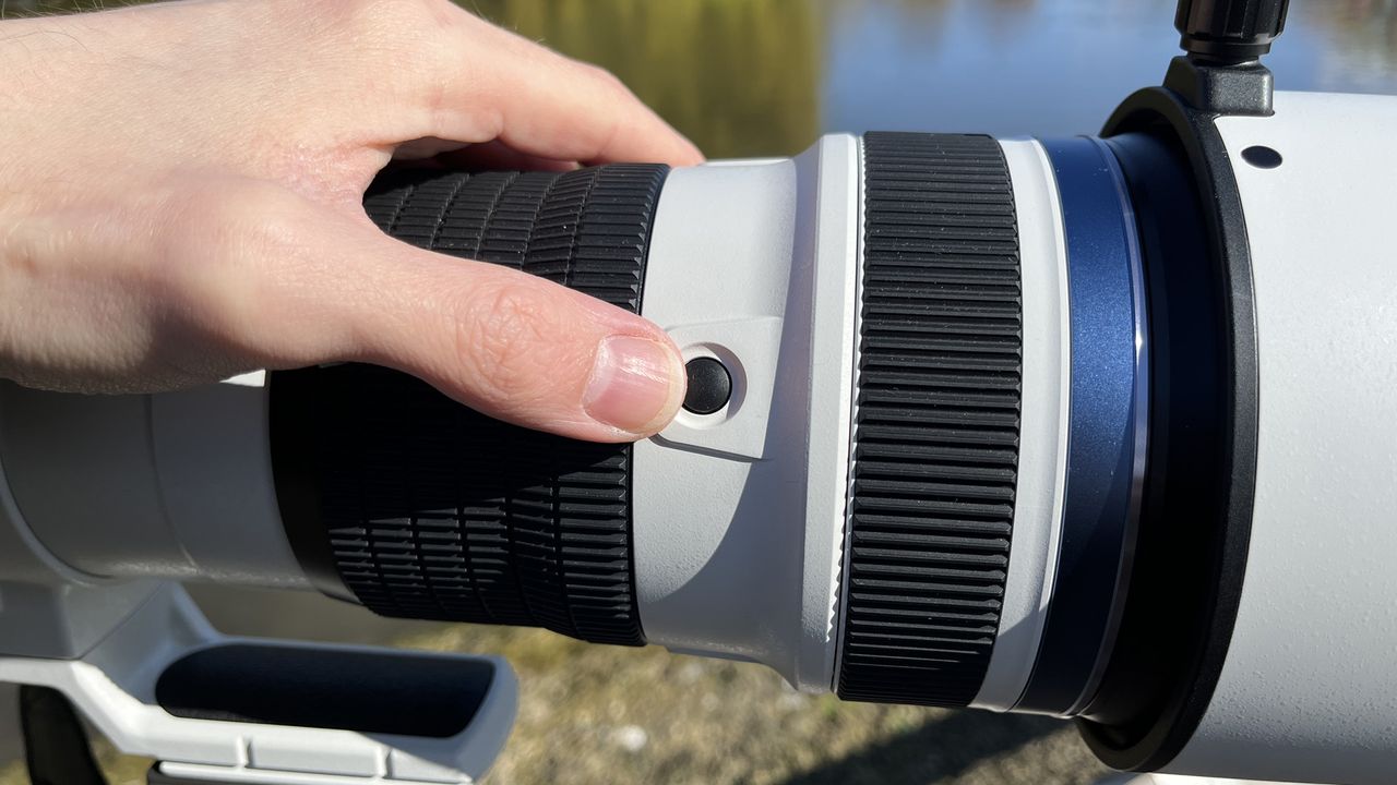 Mike Harris holding OM System M.Zuiko 150-400mm f/4.5 TC1.25x IS PRO at Slimbridge Wetland Centre