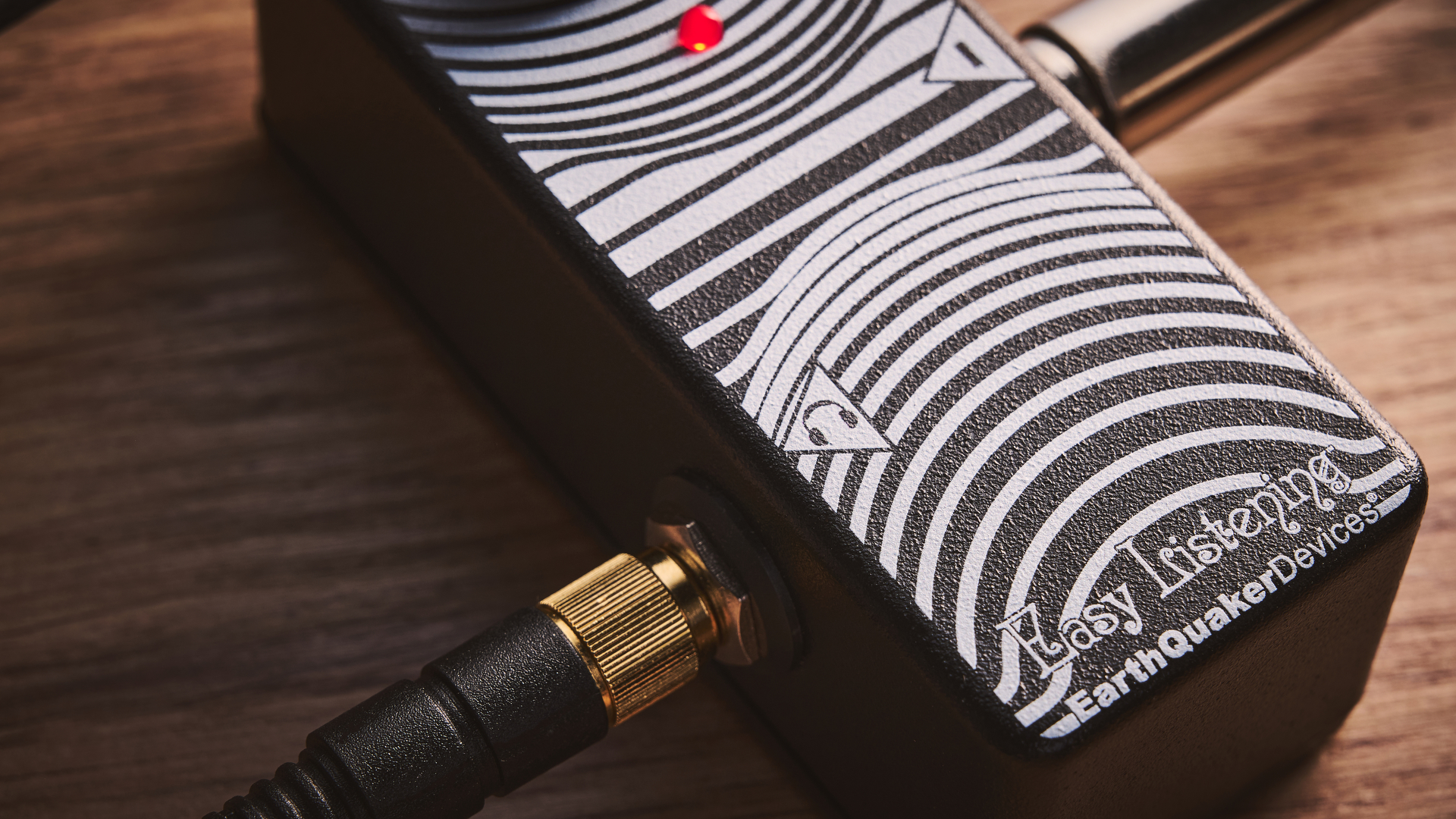 Cloes up of the headphone icon on the Earthquaker Devices Easy Listening guitar headphone amp