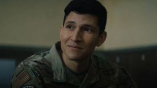 Danny Ramirez smiling, wearing a uniform in The Falcon and the Winter Soldier