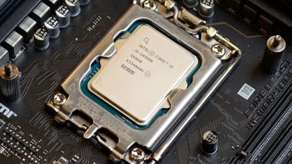 An Intel Core i9-14900K slotted into a motherboard