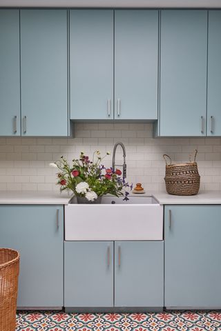 pale blue kitchen with patterned floor
