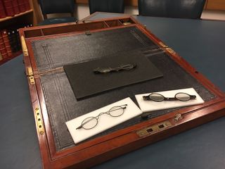 The three pairs of glasses — one wire-rimmed and two tortoiseshell — thought to belong to the legendary author Jane Austen. The glasses were found inside Austen's portable writing desk, pictured here.