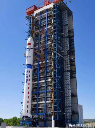 A Long March 2D rocket, topped with four satellites, stands on the pad at China's Taiyuan Satellite Launch Center ahead of its June 10, 2021 launch.