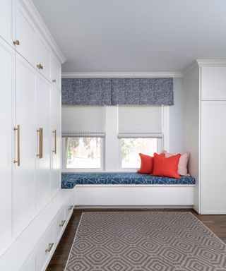 white storage with long bench with cushions, full height cupboards - Pamela Hope Designs