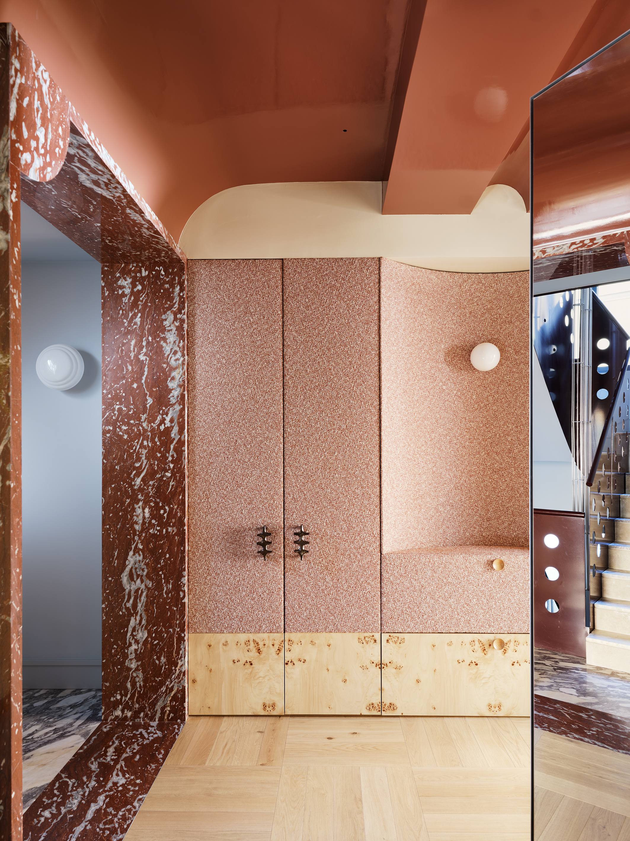terrazzo cupboard in hallway with marble floor and modern lighting