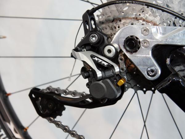 Shimano's new XTR Shadow Plus rear derailleur incorporates a slick one-way friction mechanism in the lower pivot that promises to virtually eliminate chain slap.
