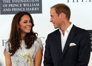 Kate Middleton and Prince William grin widely at each other at a royal polo match