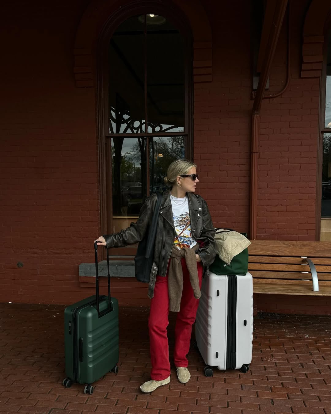Influencer Lucy Williams with two Antler suitcases