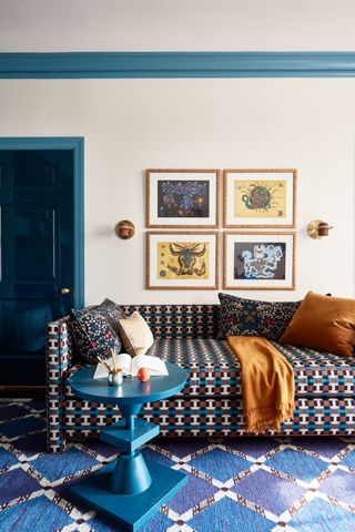 a room with a blue door and teal door trim