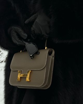 an image of an Hermès Constance bag in grey