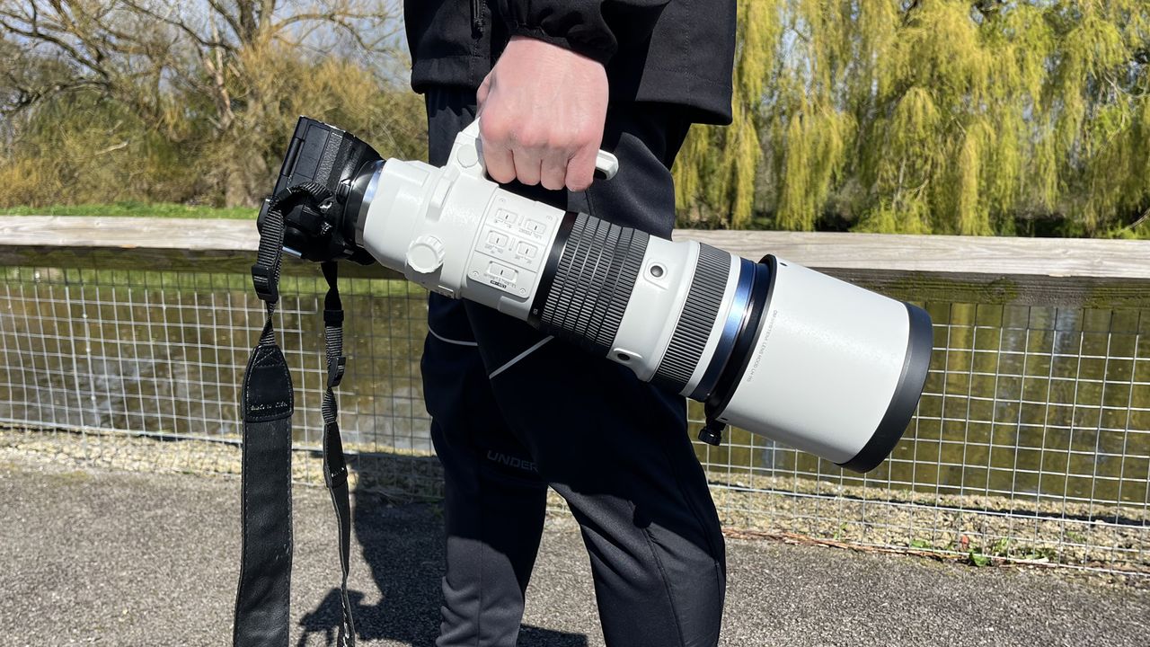 Mike Harris holding OM System M.Zuiko 150-400mm f/4.5 TC1.25x IS PRO at Slimbridge Wetland Centre