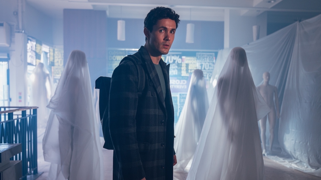 Jonah Hauer-King surrounded by covered-up mannequins in Doctor Who