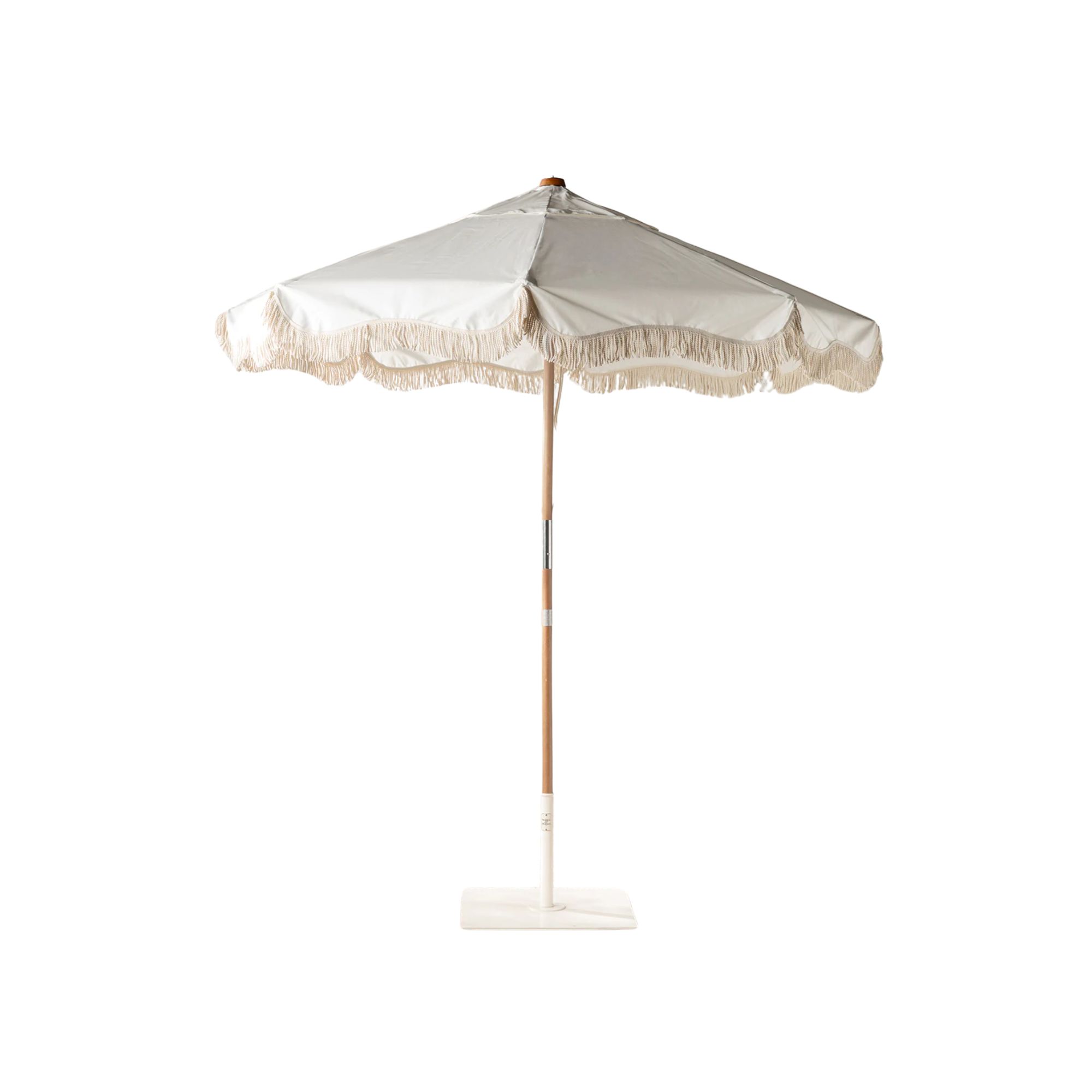 A white fringed umbrella with a bamboo pole and a white base.