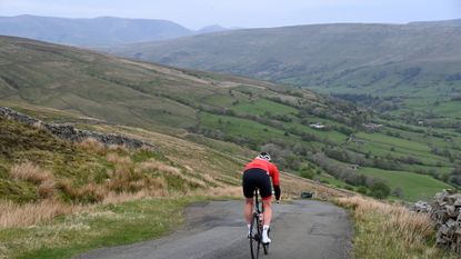 Male cyclist riding on a country lane