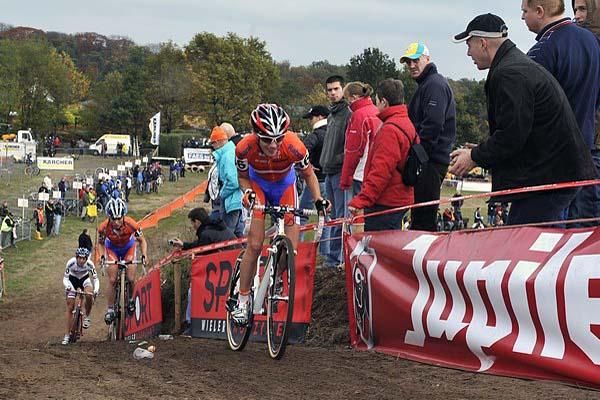 Eventual winner Marianne Vos attacks Daphne Van Den Brand and Helen Wyman on a hill.