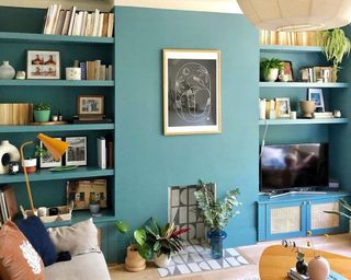 Teal living room with tiled fireplace for decorative purposes using Bert & May