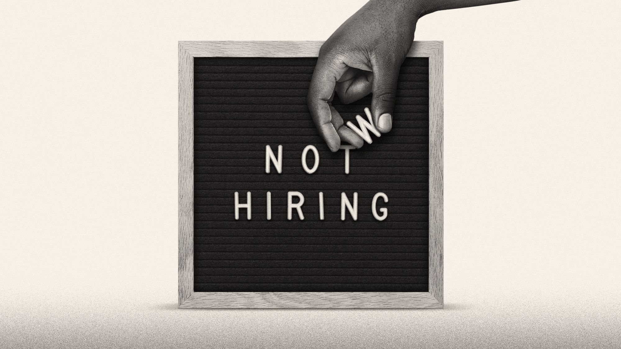 Illustration of a hand changing a "Now Hiring" advertisement to "Not Hiring"
